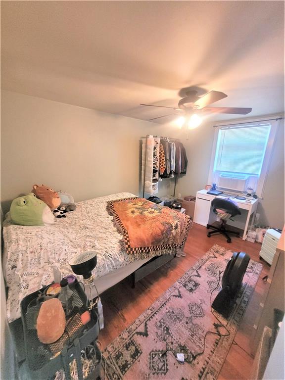 263 Robinson Street Pittsburgh, PA 15213 - Photo 10 of 21 a bedroom with bed and a chandelier