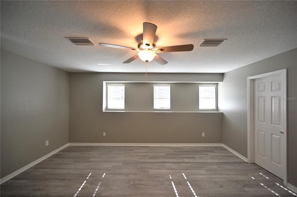 10922 Subtle Trail Drive Riverview, FL 33579 - Photo 17 of 60 a view of an empty room with a window