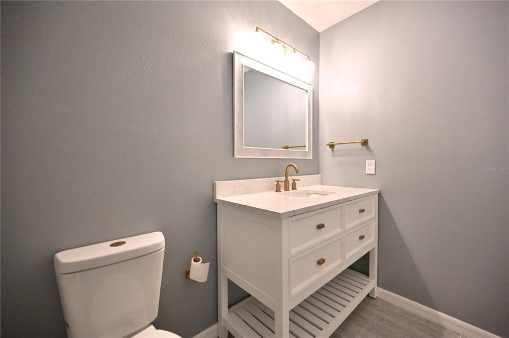 10922 Subtle Trail Drive Riverview, FL 33579 - Photo 24 of 60 a bathroom with a double vanity sink and a toilet
