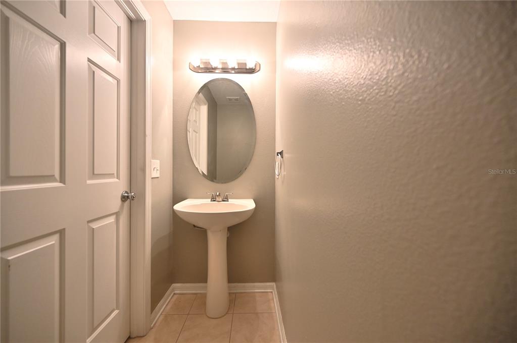 10922 Subtle Trail Drive Riverview, FL 33579 - Photo 35 of 60 a bathroom with a sink and a mirror