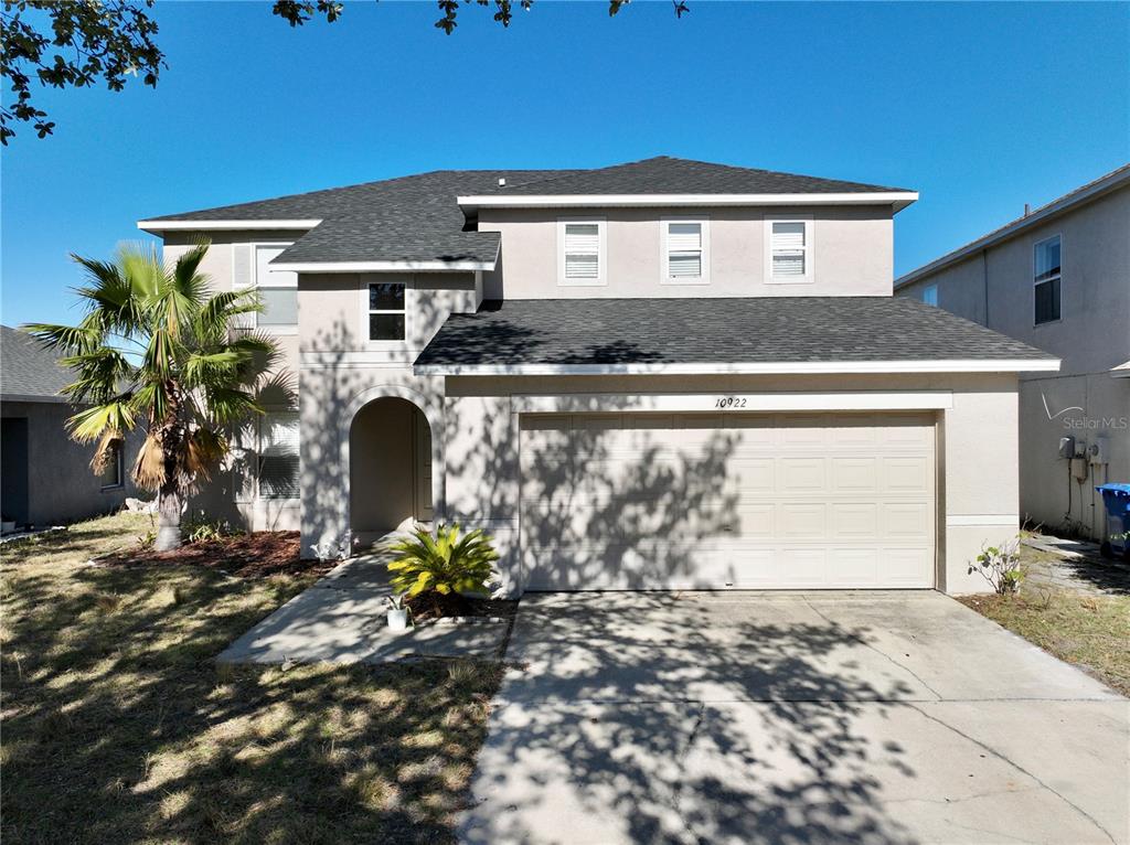 10922 Subtle Trail Drive Riverview, FL 33579 - Photo 38 of 60 a front view of a house with garden
