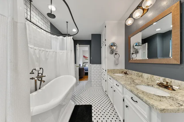 a large room with a bed and a table