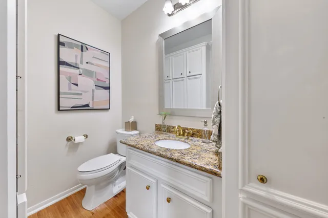 a bedroom with furniture and a large window