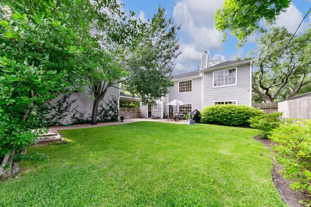 a view of a hallway with wooden floor and stairs