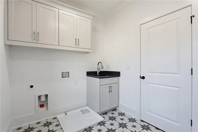 a kitchen with a sink and cabinets