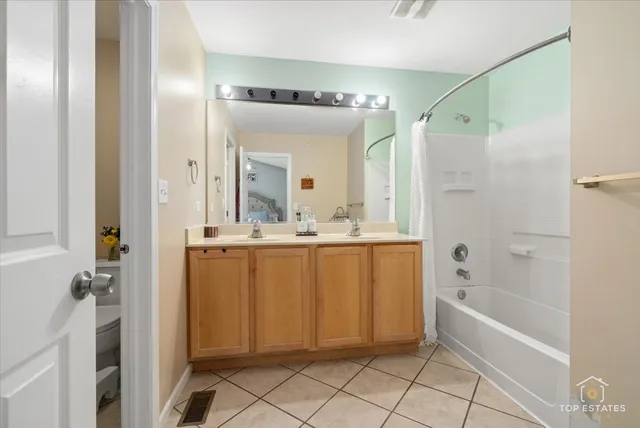 a bathroom with a bathtub a shower a sink and a mirror