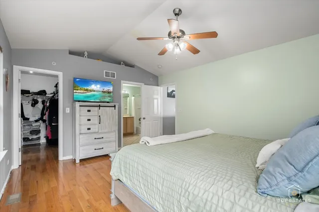 a bedroom with a bed and a walk in closet