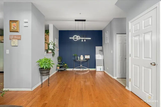 a spacious bedroom with a bed and a chandelier