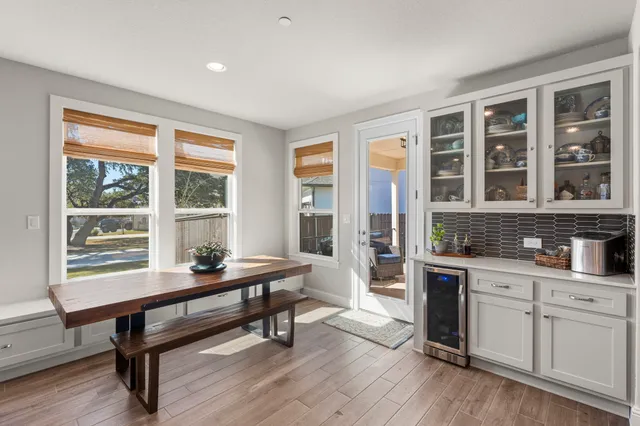 a workspace with furniture window and wooden floor