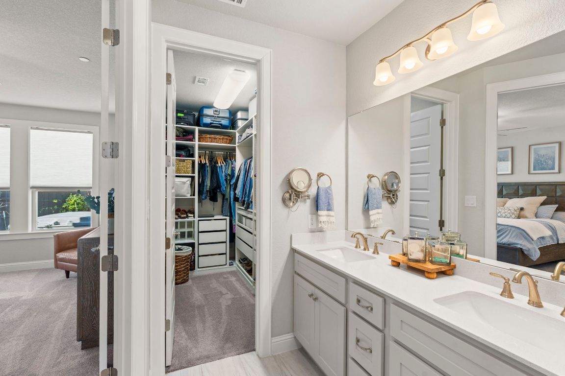 2605 Sam Bass Road, Unit 14 Round Rock, TX 78681 - Photo 15 of 30 a en suite bathroom with a sink double vanity and a mirror