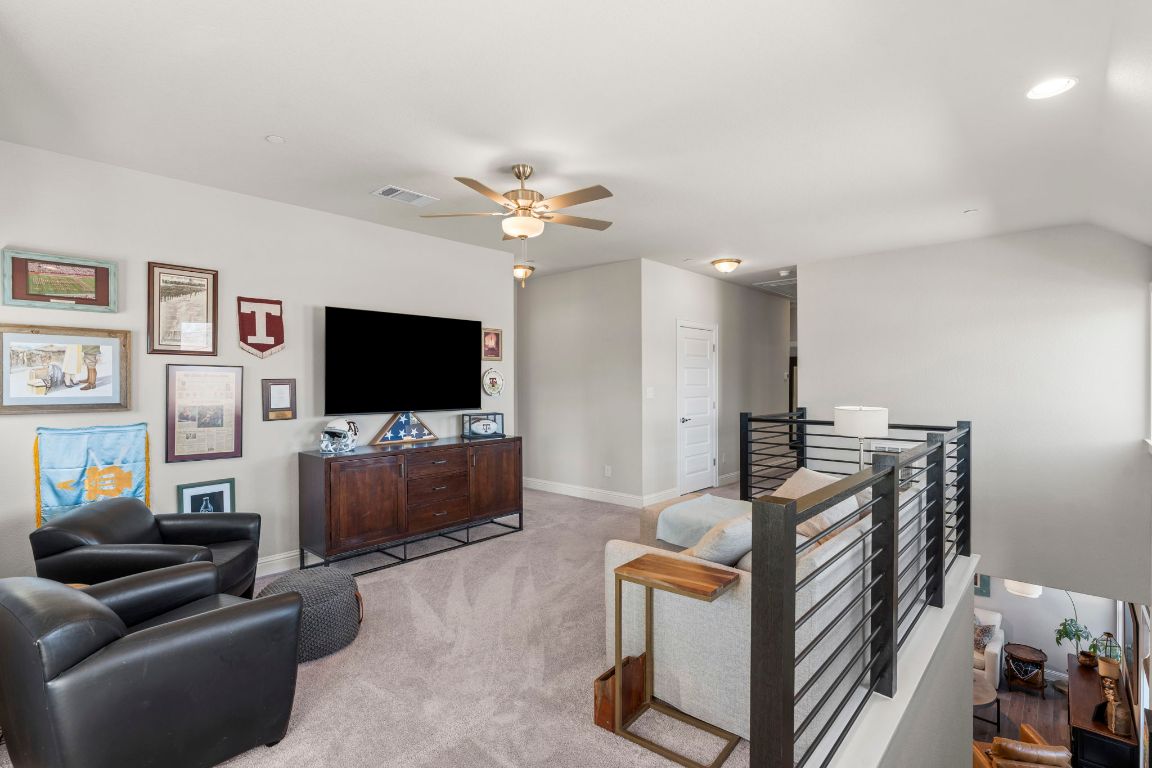 2605 Sam Bass Road, Unit 14 Round Rock, TX 78681 - Photo 16 of 30 a living room with furniture and a flat screen tv