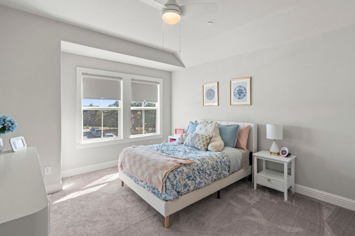 2605 Sam Bass Road, Unit 14 Round Rock, TX 78681 - Photo 18 of 30 a bedroom with a bed and a window