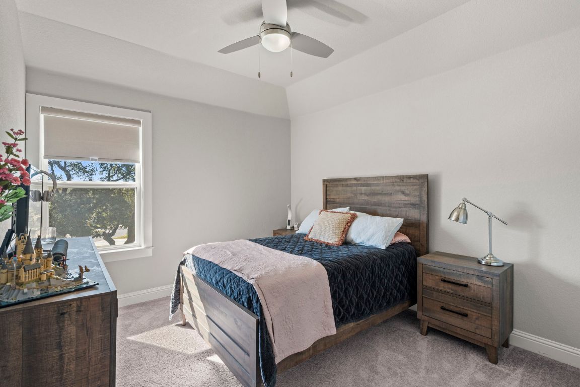 2605 Sam Bass Road, Unit 14 Round Rock, TX 78681 - Photo 23 of 30 a bedroom with bed and window