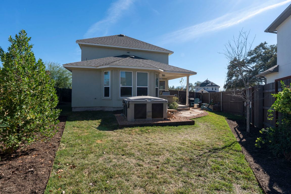 2605 Sam Bass Road, Unit 14 Round Rock, TX 78681 - Photo 28 of 30 a view of a house with backyard tub and sitting area