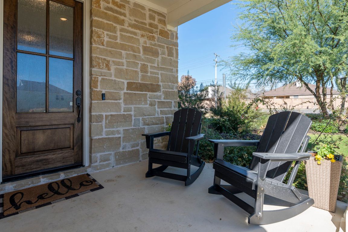 2605 Sam Bass Road, Unit 14 Round Rock, TX 78681 - Photo 3 of 30 a view of a chairs and table in a room
