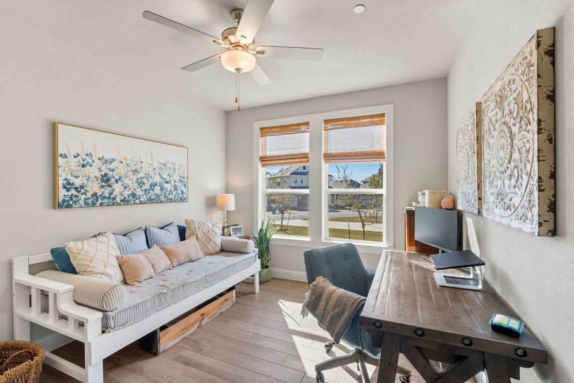 2605 Sam Bass Road, Unit 14 Round Rock, TX 78681 - Photo 6 of 30 a living room with furniture a table and a large window