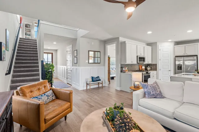 a large kitchen with kitchen island a sink stainless steel appliances and cabinets