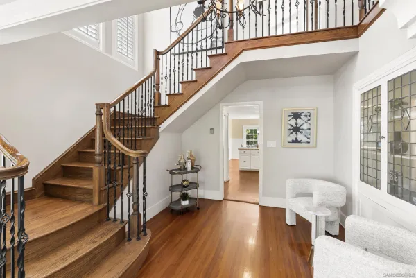 a view of entryway and hall with wooden floor