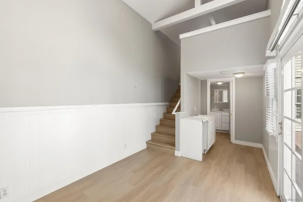 a view of an entryway with wooden floor