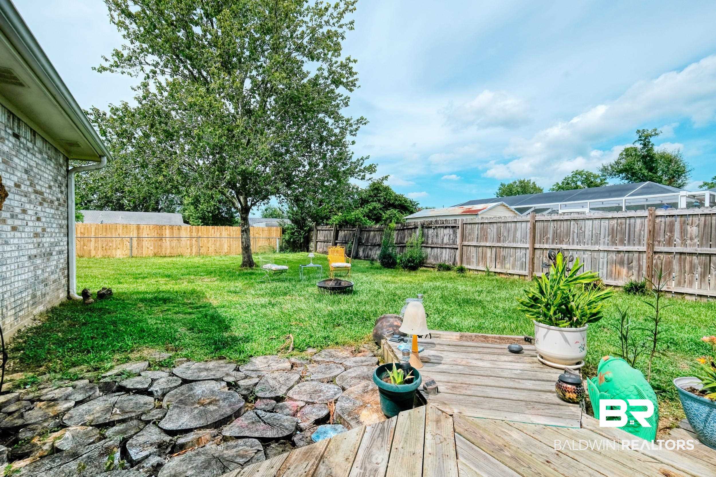 504 Ariel Avenue Foley, AL 36535 - Photo 8 of 33 View of yard featuring a lanai and a deck