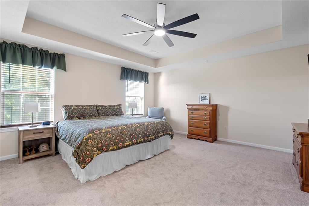 2284 Flint Drive Washington, PA 15301 - Photo 13 of 28 a spacious bedroom with a bed and a ceiling fan