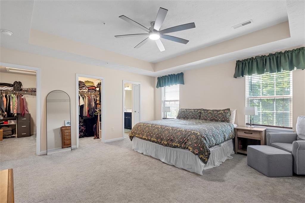 2284 Flint Drive Washington, PA 15301 - Photo 14 of 28 a spacious bedroom with a bed a couch and a large window