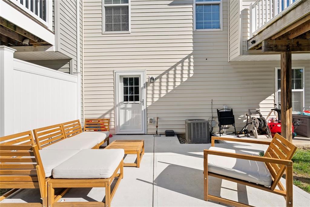2284 Flint Drive Washington, PA 15301 - Photo 27 of 28 a view of a patio with couches table and chairs and potted plants