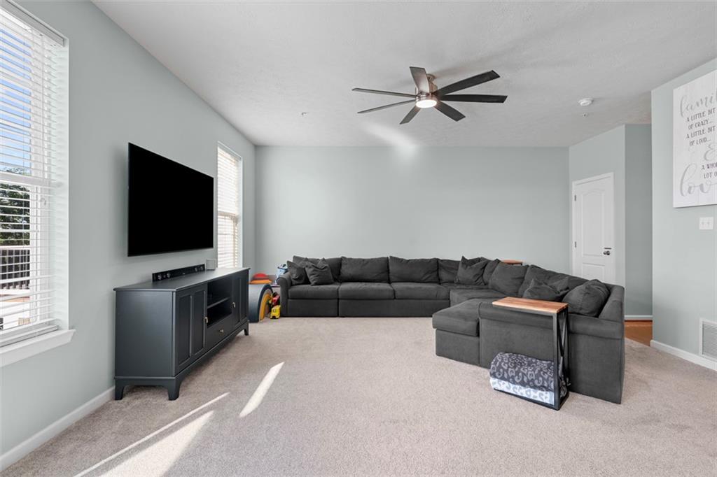 2284 Flint Drive Washington, PA 15301 - Photo 7 of 28 a living room with furniture and a flat screen tv