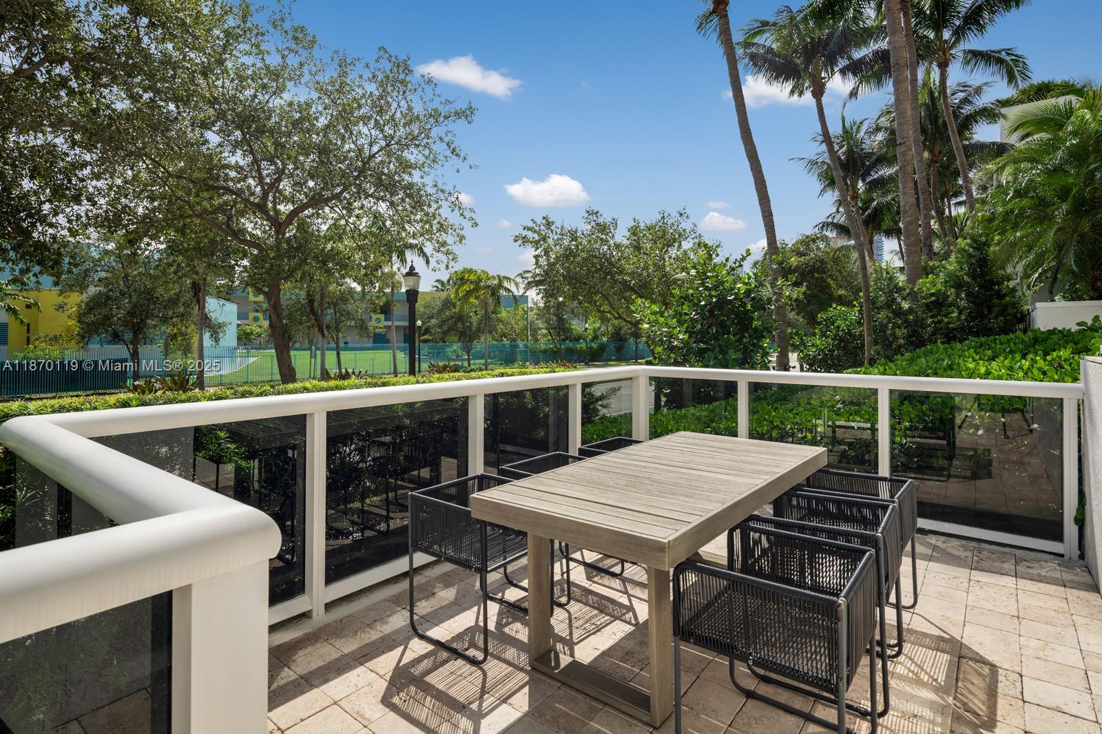 400 Alton Road, Unit TH1A Miami Beach, FL 33139 - Photo 14 of 45 a view of roof deck with furniture and barbeque oven