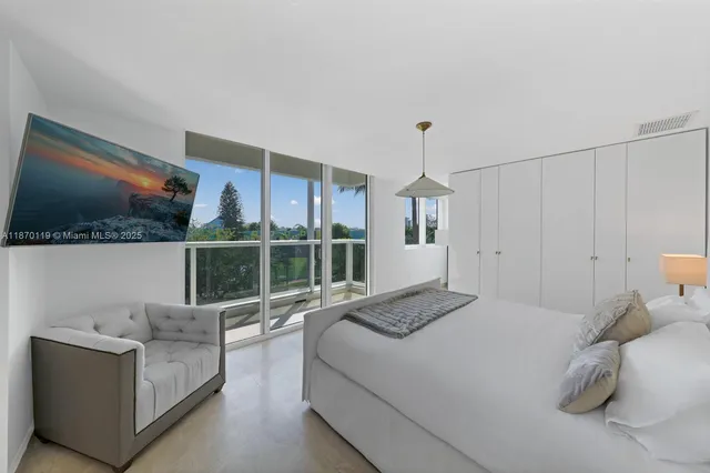 a bedroom with bed and window