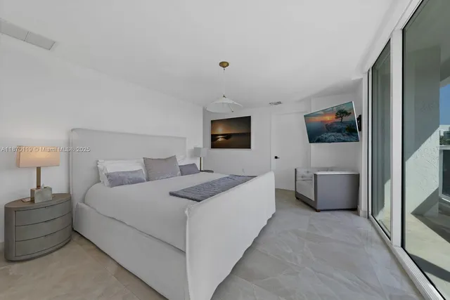 a bathroom with a granite countertop sink mirror and toilet