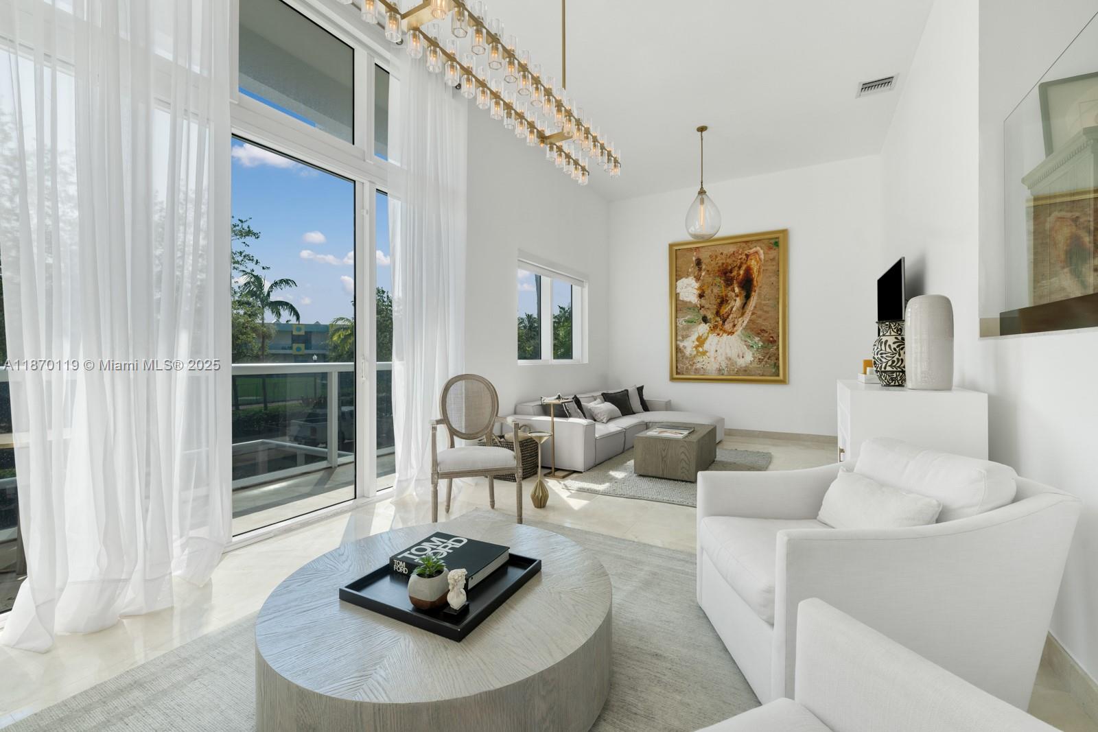 400 Alton Road, Unit TH1A Miami Beach, FL 33139 - Photo 4 of 45 a living room with furniture and a potted plant