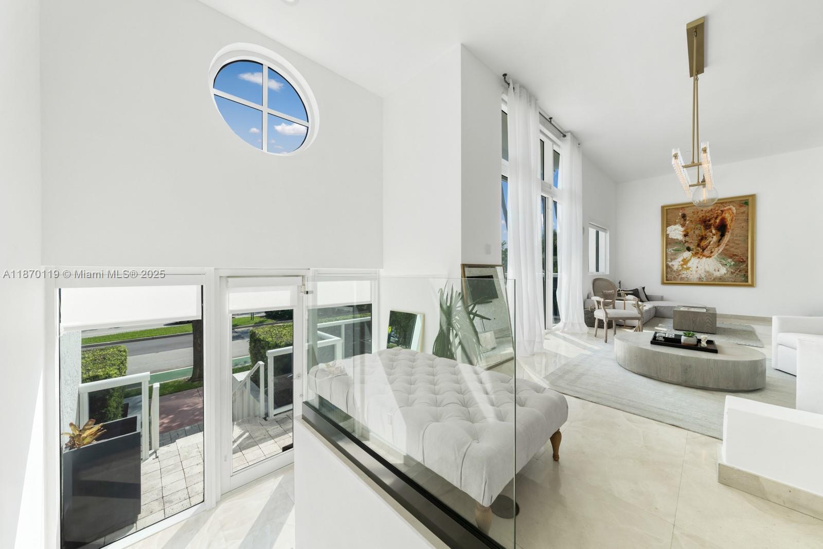 400 Alton Road, Unit TH1A Miami Beach, FL 33139 - Photo 7 of 45 a living room with furniture potted plant and a large window