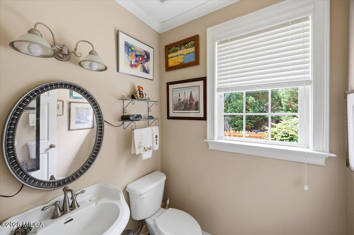 210 Oberon Place Macon, GA 31210 - Photo 26 of 31 a bathroom with a toilet a sink and a mirror