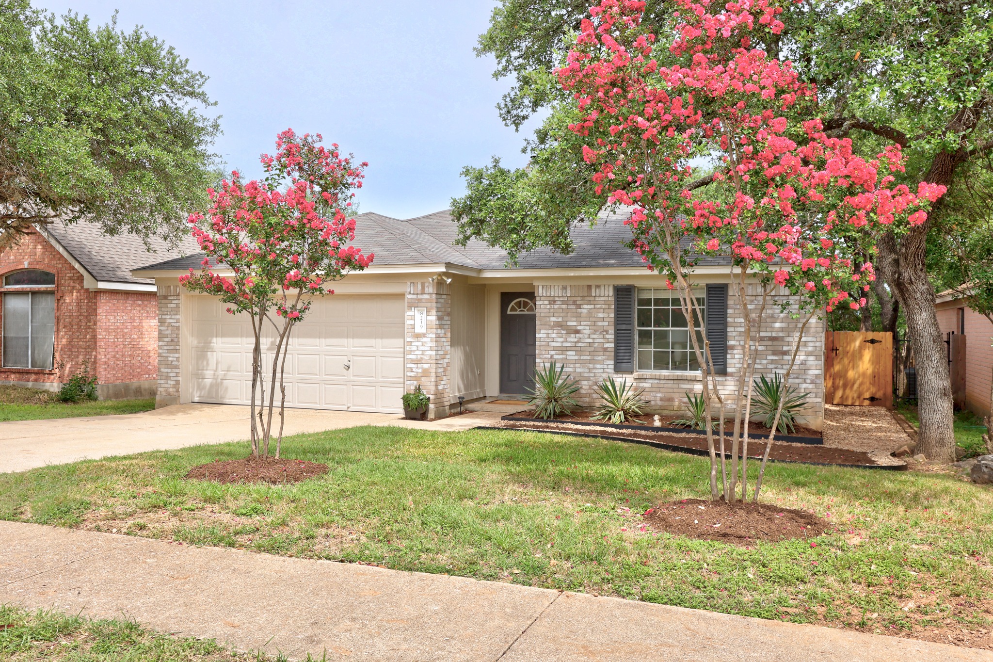 8219 Edgemoor Place Austin, TX 78749 - Photo 3 of 30 Landscaping overhaul including freshly mulched garden beds.