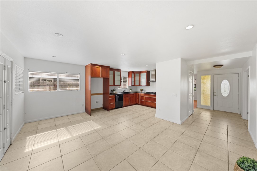 6090 Meadowbrook Lane Riverside, CA 92504 - Photo 14 of 37 Open-concept feel with generous dining space, tile flooring, and direct access to the entry and main living areas.