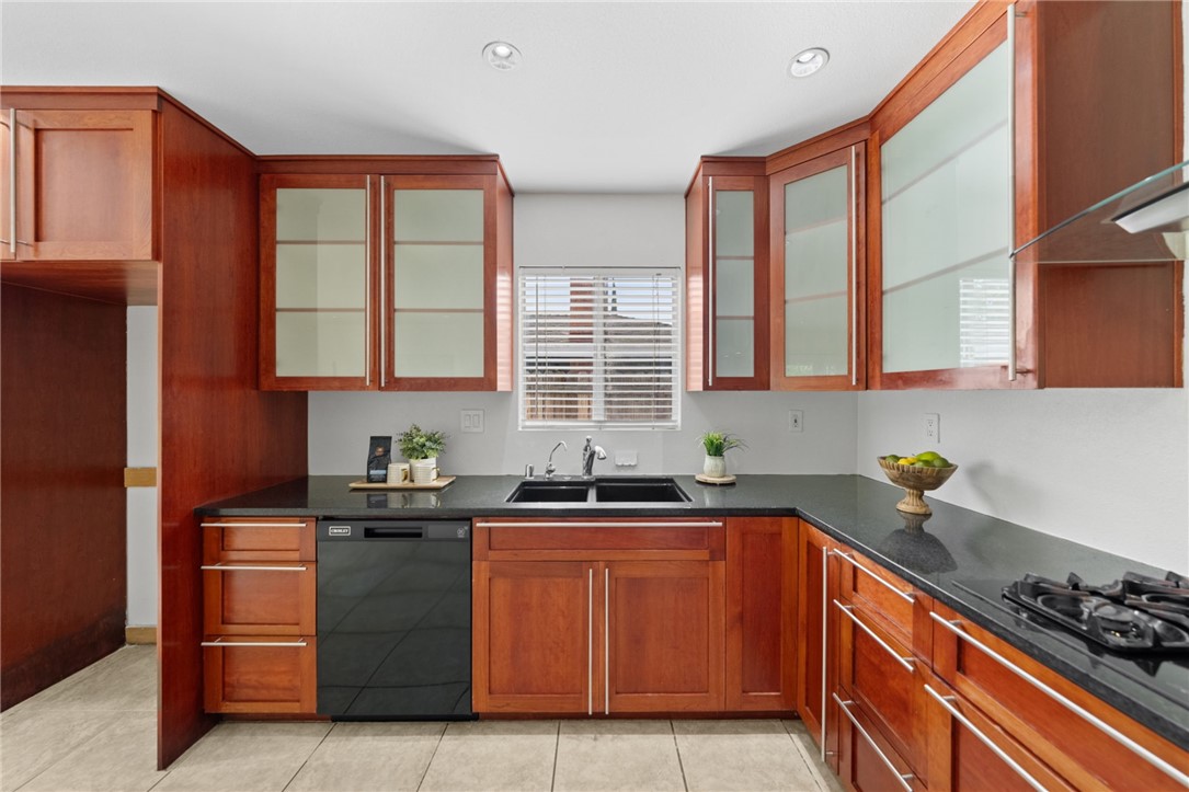 6090 Meadowbrook Lane Riverside, CA 92504 - Photo 17 of 37 Clean, bright kitchen with modern cabinetry, generous prep space, and abundant natural light from multiple windows.
