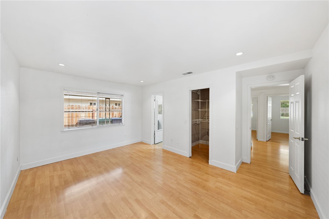 6090 Meadowbrook Lane Riverside, CA 92504 - Photo 21 of 37 Bedroom 2 - Generous primary suite with wood floors, recessed lighting, and direct access to the ensuite bath and closets.