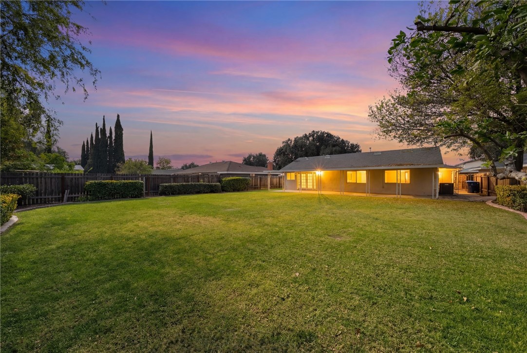 6090 Meadowbrook Lane Riverside, CA 92504 - Photo 6 of 37 Large, open yard with a generous covered patio and evening ambiance for entertaining.