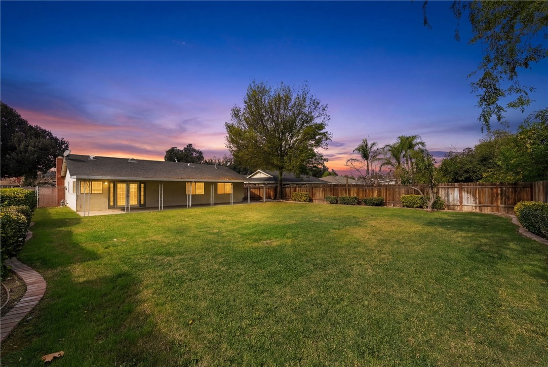 6090 Meadowbrook Lane Riverside, CA 92504 - Photo 7 of 37 Expansive, level lawn with a covered patio—great for outdoor dining and everyday relaxing.