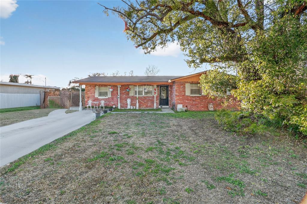 front view of a house with a tree
