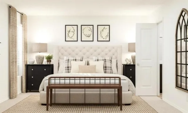 a bedroom with a bed painting on wall and a potted plant