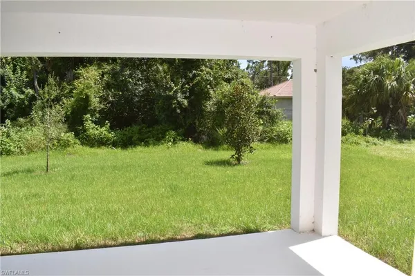 a view of a yard from a balcony