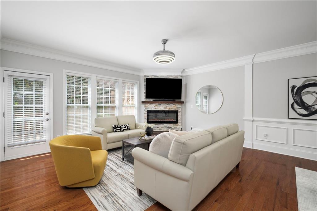 2872 Overlook Way Northeast Atlanta, GA 30324 - Photo 3 of 47 a living room with furniture a flat screen tv and wooden floor