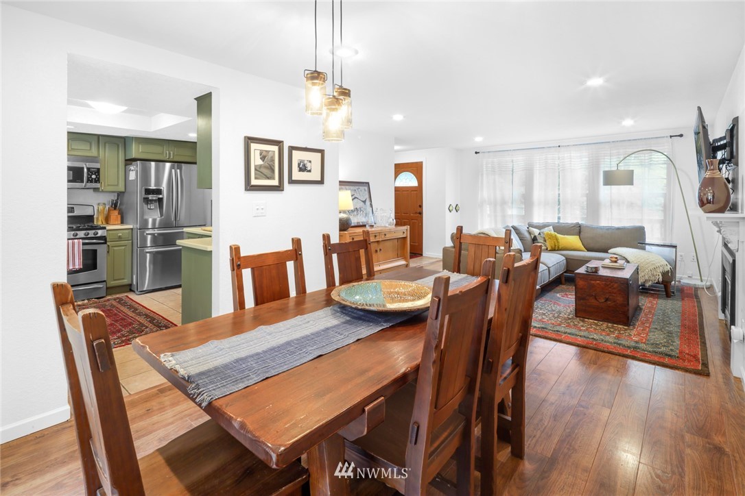 3853 Magrath Road Bellingham, WA 98226 - Photo 11 of 40 a view of a dining room with furniture window and wooden floor