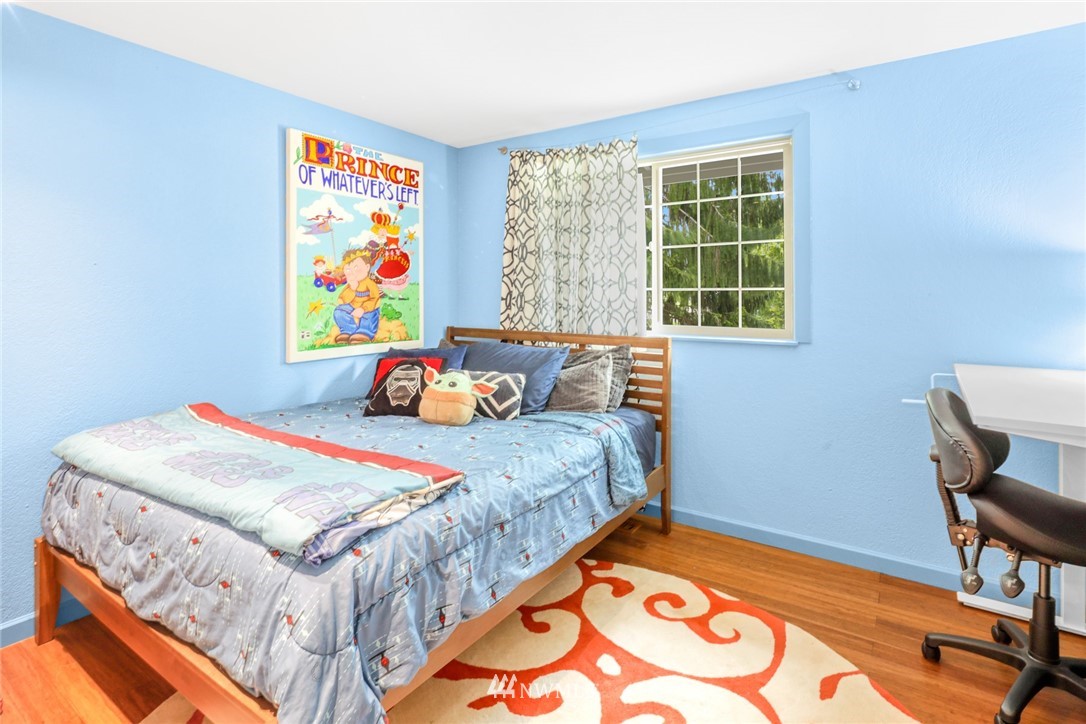 3853 Magrath Road Bellingham, WA 98226 - Photo 22 of 40 a bedroom with a bed and a table in it