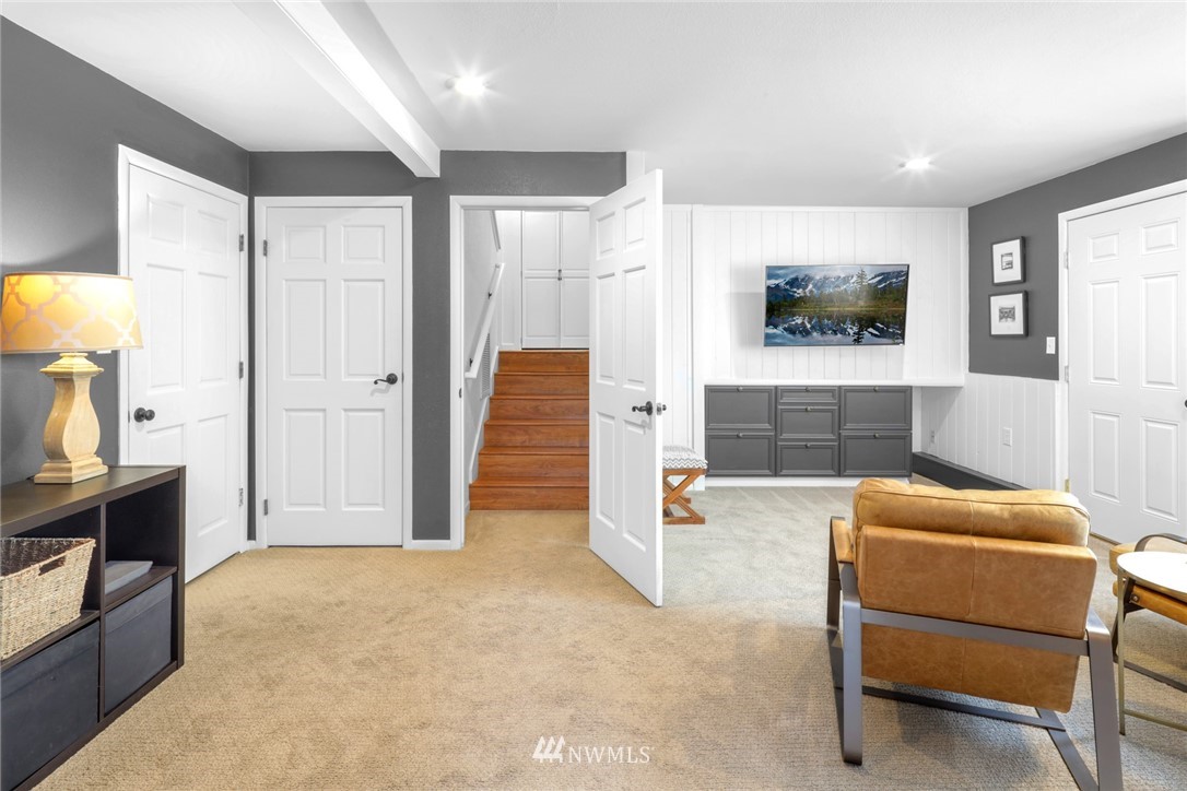 3853 Magrath Road Bellingham, WA 98226 - Photo 27 of 40 a bedroom with furniture and a flat screen tv