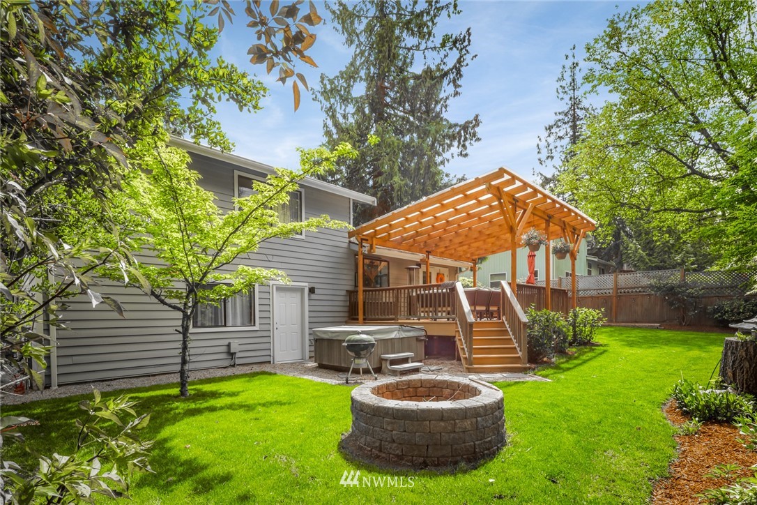 3853 Magrath Road Bellingham, WA 98226 - Photo 38 of 40 a view of a chair and fire pit in the backyard