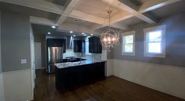 a view of a kitchen and a window