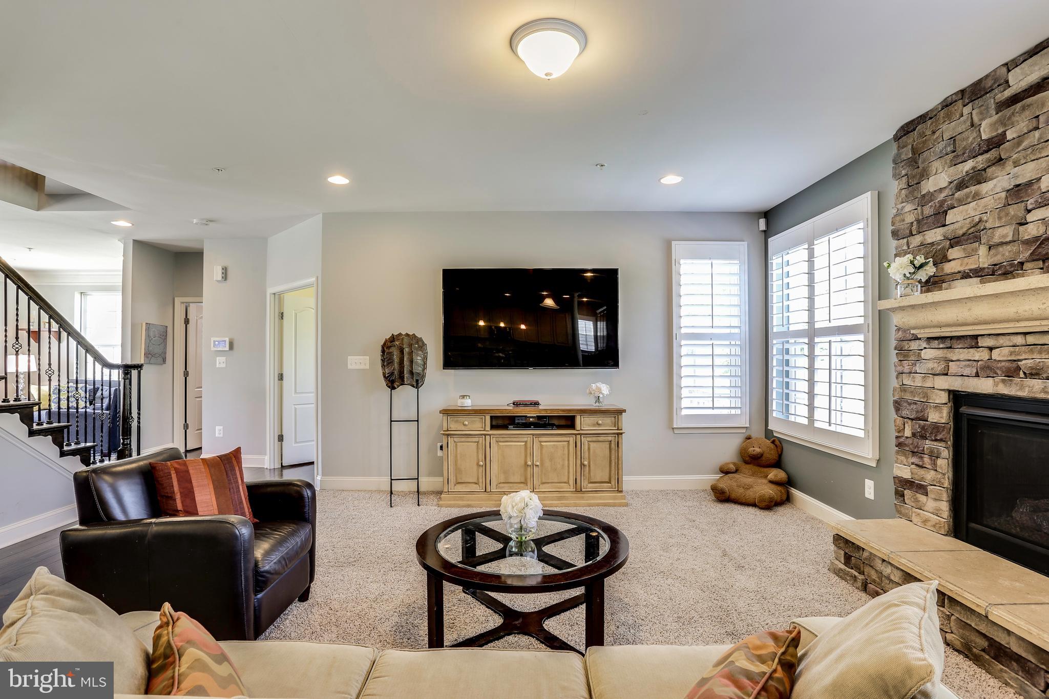 6721 Evanston Road Baltimore, MD 21209 - Photo 12 of 38 Large Family Room w/ Stone Surround Gas Fireplace